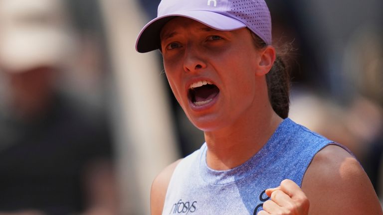 Poland's Iga Swiatek celebrates as she won the quarterfinal match of the French Tennis Open against Ukraine's Elina Svitolina