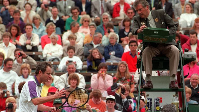 John McEnroe argues a line-call with umpire George Grime during his quarter-final against Guy Forget on Court One at Wimbledon.