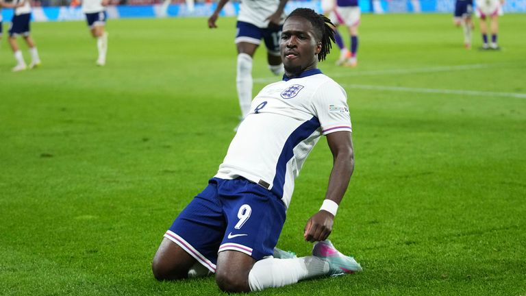 Jonathan Rowe slides on his knees to celebrate after putting England 3-2 against Germany in overtime of the U21 Euro final