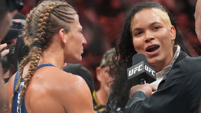 Kayla Harrison, left, talks to Amanda Nunes after her women's bantamweight bout against Julianna Peña at UFC 316