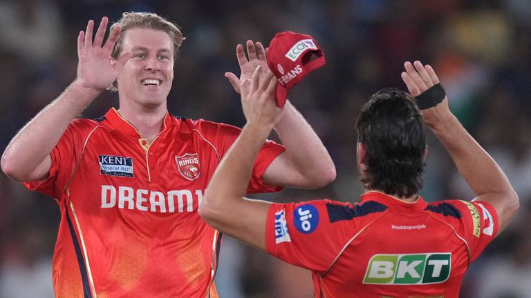 Punjab Kings' Kyle Jamieson , centre , celebrates the dismissal of Royal Challengers Bengaluru's captain Rajat Patidar during the Indian Premier League cricket final match between Punjab Kings and Royal Challengers Bengaluru at Narendra Modi Stadium in Ahmedabad, India, Tuesday, June 3, 2025. (AP Photo/ Ajit Solanki )