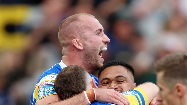 Leeds Rhinos' Cameron Smith (centre) celebrates with team-mates after scoring a try