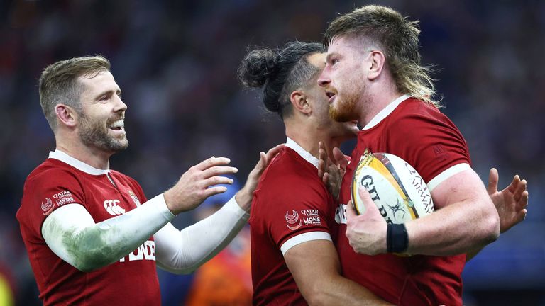 Try scorer Joe McCarthy is congratulated by Lions team-mates James Lowe and Elliot Daly