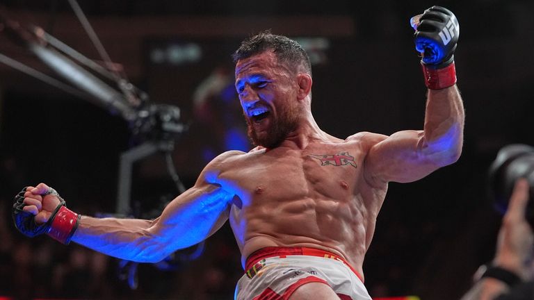 Georgia's Merab Dvalishvili, left, celebrates after winning his bantamweight title bout against Sean O'Malley at UFC 316