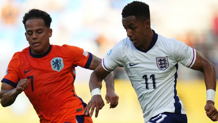 England's Omari Hutchinson, right, duels with Netherlands' Million Manhoef during the semi-final of the U21 Euros 