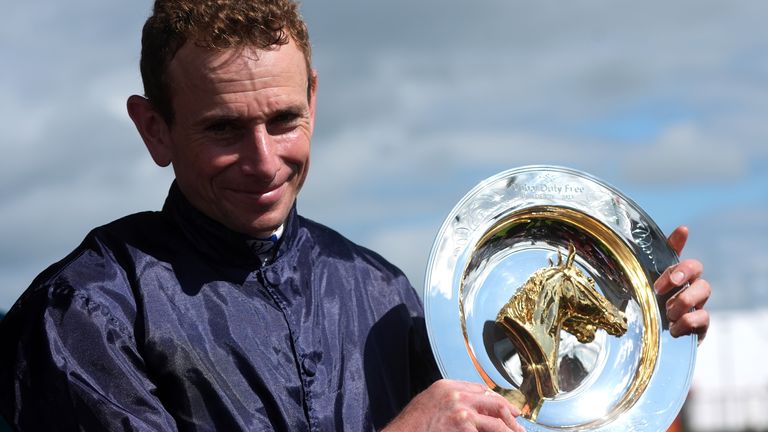 Ryan Moore celebrates victory in the Irish derby