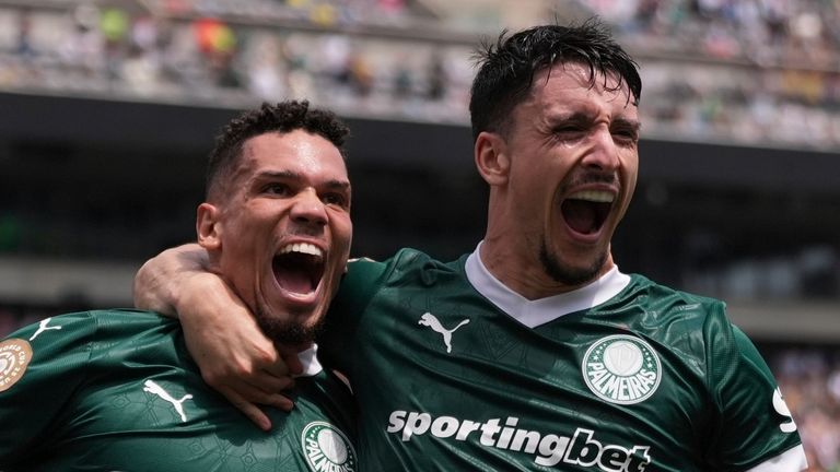 Palmeiras' Paulinho, left, celebrates with Joaquin Piquerezd after scoring the opening goal during the Club World Cup round of 16 soccer match between Palmeiras and Botafogo in Philadelphia, Saturday, June 28, 2025. (AP Photo/Matt Slocum)