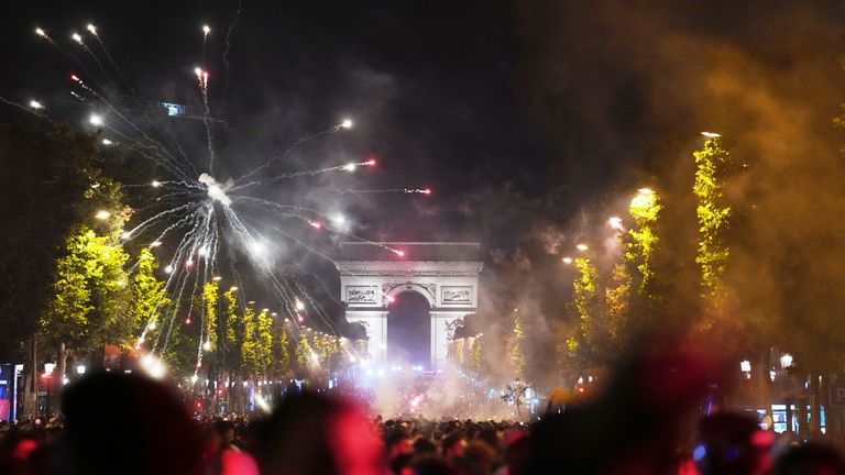 Supporters celebrate PSG's victory in Champs-Elysees