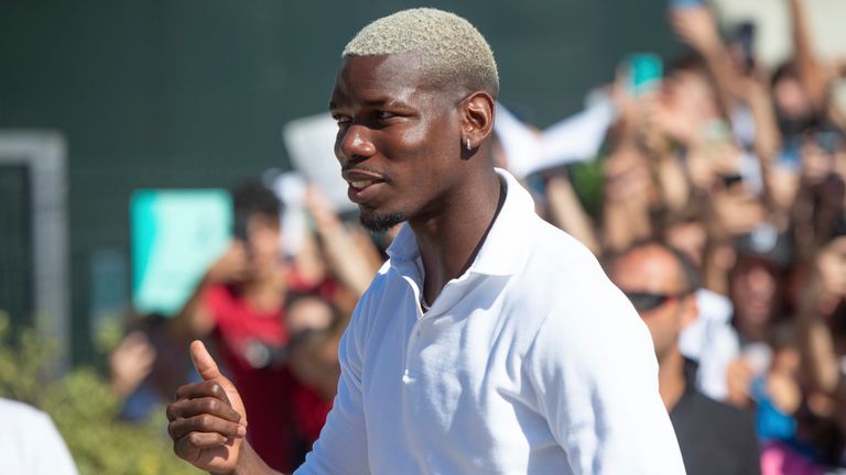 Midfielder Paul Pogba gives the thumbs up as he arrives at Juve's Medical Center, in Turin, northern Italy, Saturday, July 9, 2022. More than 1,000 fans welcomed Paul Pogba back home as he returned to Juventus on a free transfer from Manchester United on Saturday. (LaPresse via AP)