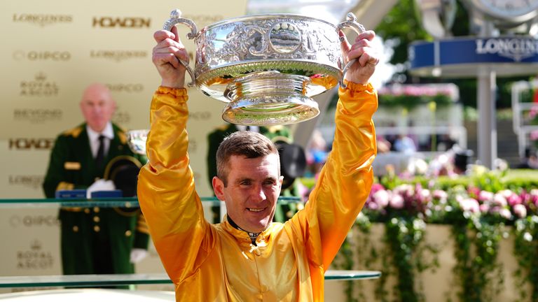 Gary Carroll Hisist The Coronation Stakes Trophy in the air after having guided Cercene Home to Royal Ascot