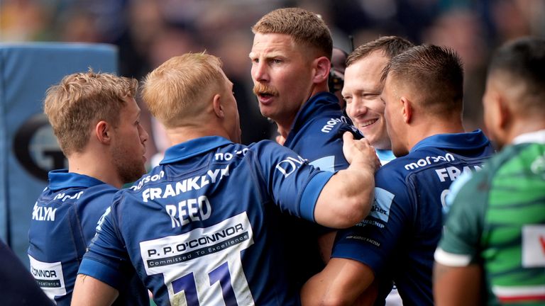 Robert du Preez celebrates with team-mates after scoring Sale's first try against Leicester