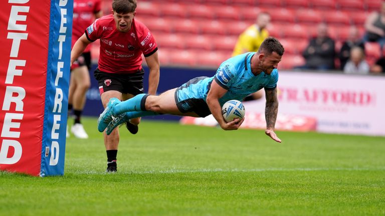 Hull FC's Cade Cust scores their side's first try of the game during the Betfred Super League match against Salford Red Devils