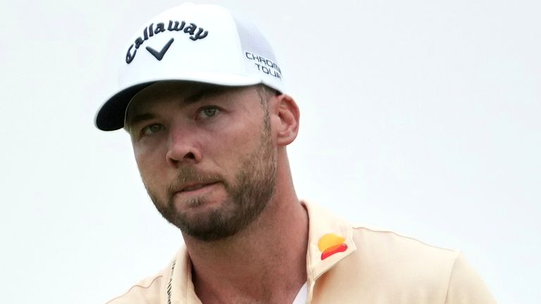 Sam Burns celebrates after making a putt on the 18th hole during the second round of the U.S. Open golf tournament at Oakmont Country Club Friday, June 13, 2025, in Oakmont, Pa. (AP Photo/Gene J. Puskar)