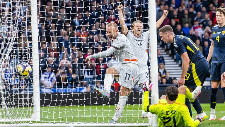 GLASGOW, SCOTLAND - JUNE 06: Iceland's Jon Dagur Thorsteinsson (L) celebrates as Scotland's Lewis Ferguson (R) scores an own goal to make it 2-1 during an International Friendly match between Scotland and Iceland at Hampden Park, on June 06, 2025, in Glasgow, Scotland. (Photo by Alan Harvey / SNS Group)