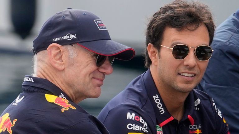 Red Bull technical director Adrian Newey is flanked by Red Bull driver Sergio Perez of Mexico and former F1 driver Alain Prost arrive ahead the third free practice, at the Monaco racetrack, in Monaco, Saturday, May 25, 2024. The Formula one race will be held on Sunday. (AP Photo/Luca Bruno)