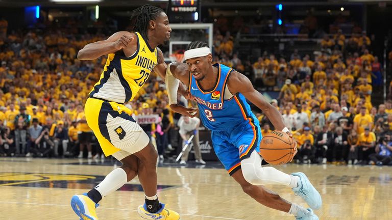 Oklahoma City Thunder guard Shai Gilgeous-Alexander drives as Aaron Nesmith. (AP Photo/Michael Conroy)