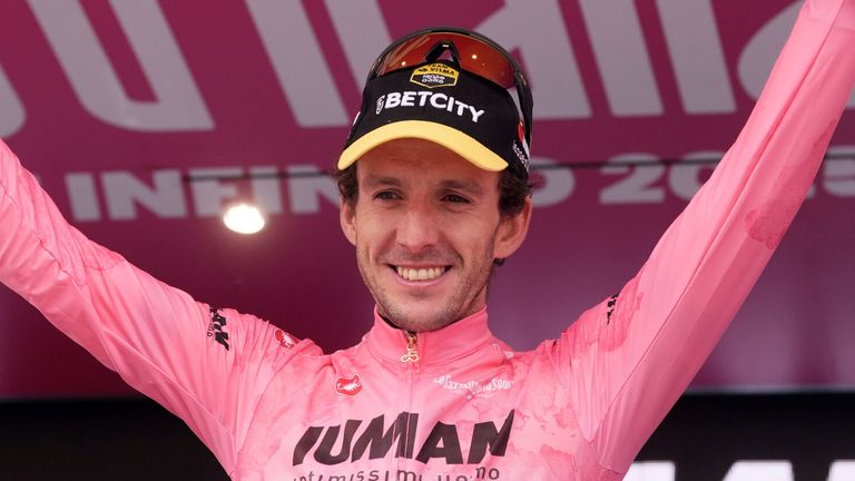 Simon Yates of Team Visma | Lease A Bike pink jersey on the podium during the stage 20 of the Giro d'Italia from Verres to Sestriere (Via Lattea), Italy, Saturday, May 31, 2025. (Massimo Paolone/LaPresse via AP)