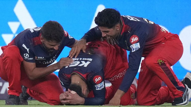 Royal Challengers Bengaluru's Virat Kohli, center, reacts after their win in the Indian Premier League final cricket match against Punjab Kings at Narendra Modi Stadium in Ahmedabad, India, Tuesday, June 3, 2025. (AP Photo/Ajit Solanki)