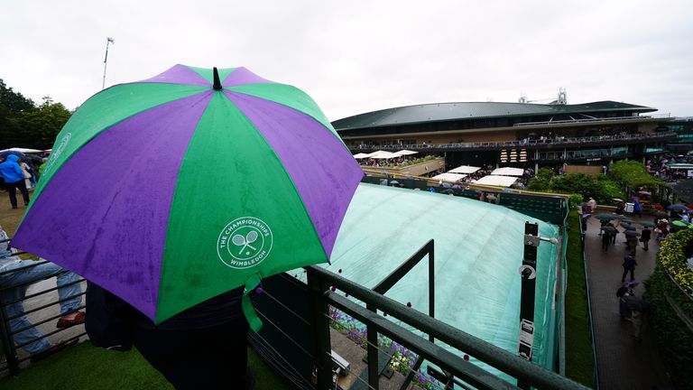 A general view of the covered outside courts as rain falls on day nine of the 2024 Wimbledon Championships at the All England Lawn Tennis an