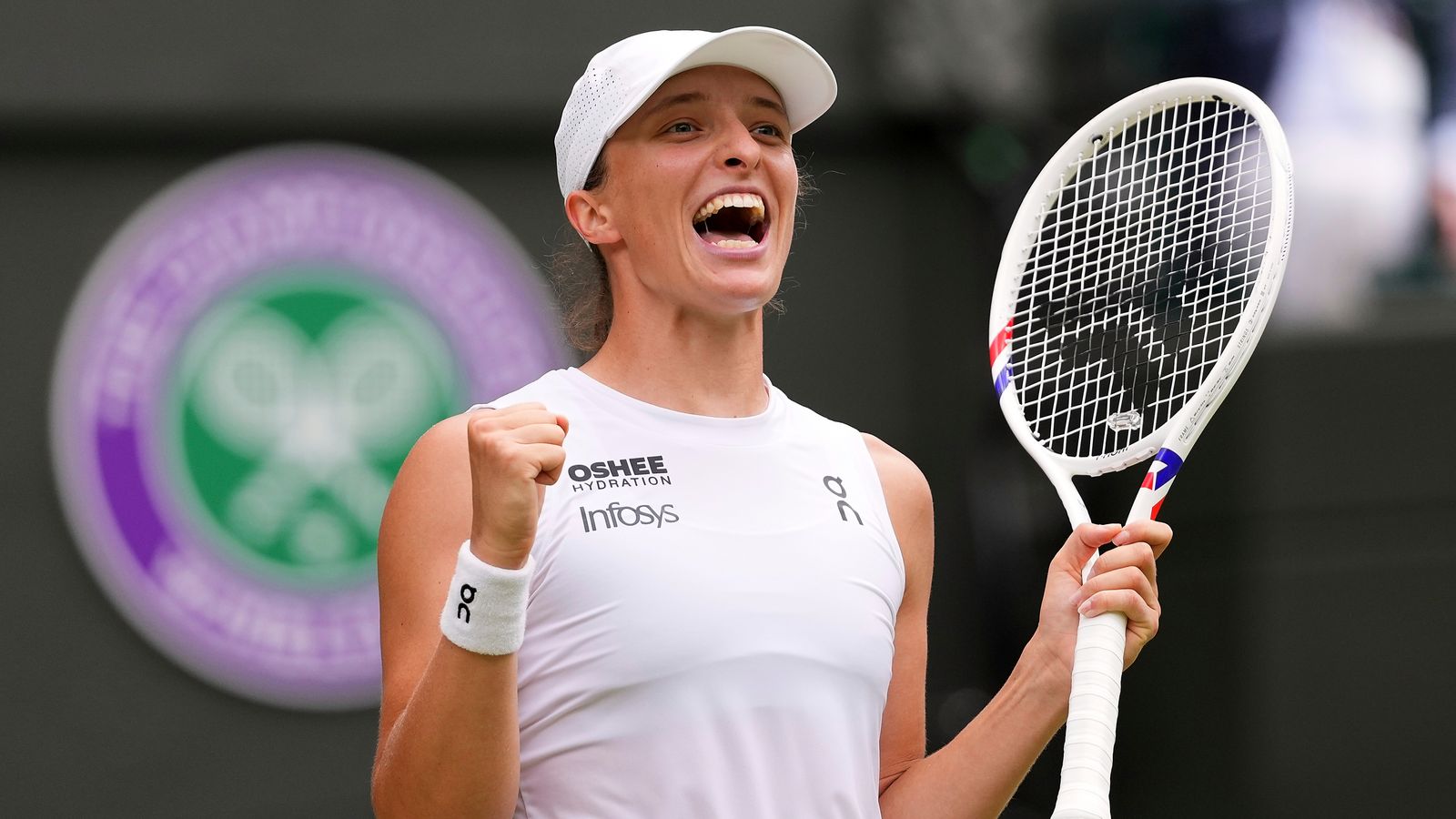 Swiatek smashes grass ceiling to set up semi-final with unseeded Bencic