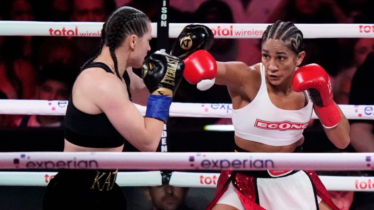 Puerto Rico's Amanda Serrano, right, punches Ireland's Katie Taylor during the second round of a super lightweight championship boxing match Friday, July 11, 2025, in New York. (AP Photo/Frank Franklin II)