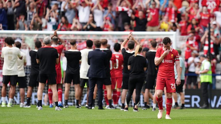 Andy Robertson was obviously emotional when Liverpool players applauded travel fans, who reported the name of Diogo Jota