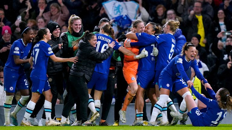 Ann-Katrin Berger is mobbed by her teammates after winning a penalty shootout against Lyon