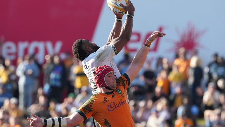 Fiji's Viliame Mata, top, wins a high ball against Australia's Harry Wilson during their rugby union international match in Newcastle, Australia, Sunday, July 6, 2025. (AP Photo/Mark Baker)