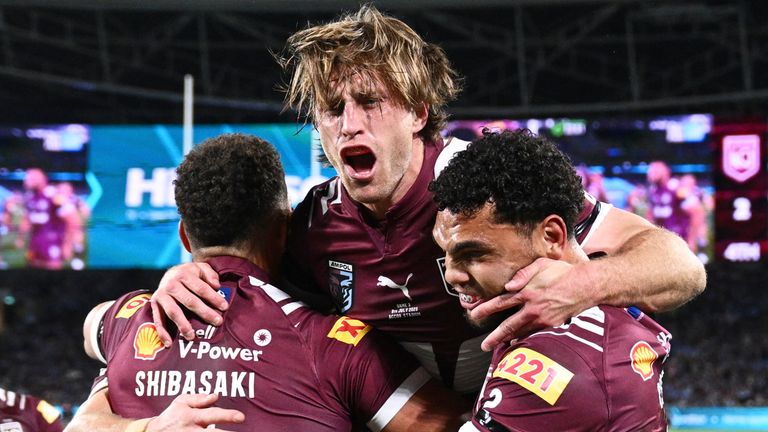 Cameron Munster of the Maroons celebrates with teammates. (Dan Himbrechts/AAPImage via AP)