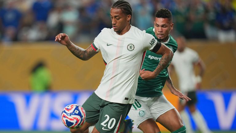 Chelsea's Joao Pedro controls the ball chased by Palmeiras' Paulinho during the Club World Cup