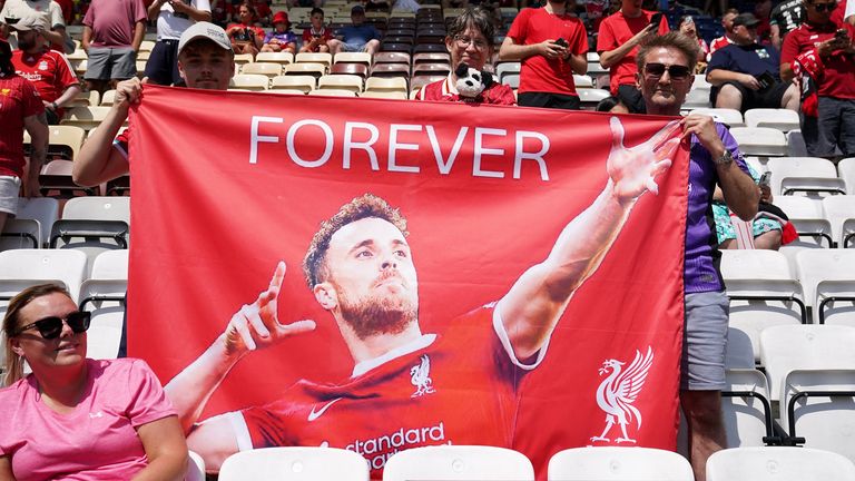 Liverpool fans have a flag paying tribute to Diogo Jota before the match against Preston North End