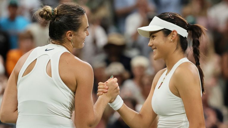 Emma Raducanu of the United Kingdom (R) greets Aryna Sabalenka of Belarus at the net after winning the women's singles third-round match on day five of the Wimbledon Championships at the All England Lawn Tennis and Croquet Club in London, on Friday, July 4, 2025. ( The Yomiuri Shimbun via AP Images )