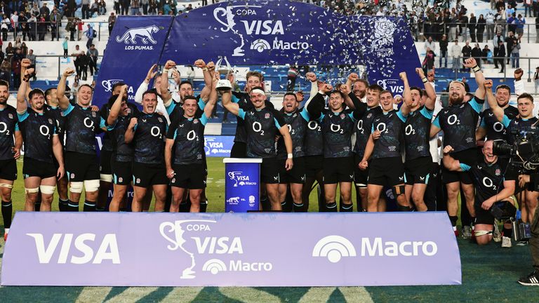 England players celebrate after their team defeated Argentina at the end of their rugby test match in San Juan, Argentina