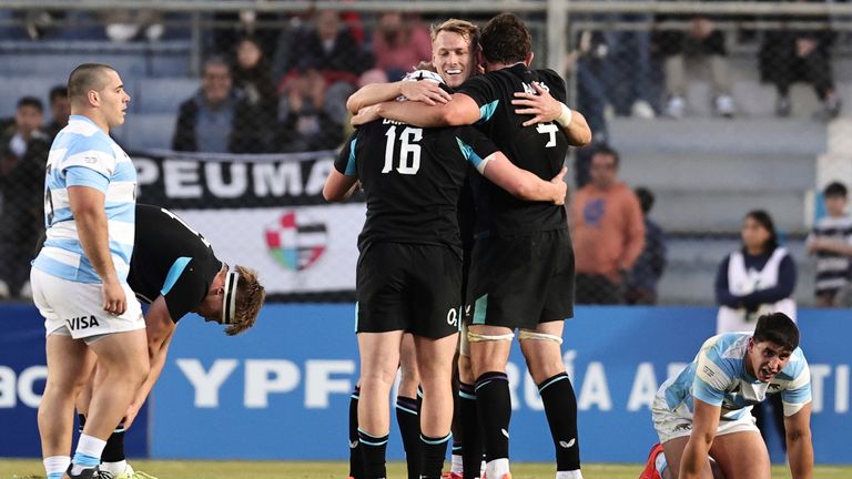 England players, center, celebrate after defeating Argentina during a rugby test match in San Juan, Argentina, Saturday, July 12, 2025. (AP Photo/Nicolas Aguilera)