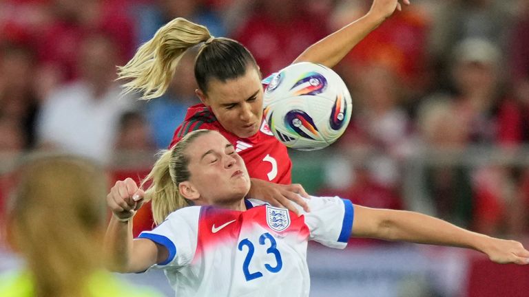 Wales' Gemma Evans, challenges England's Alessia Russo
