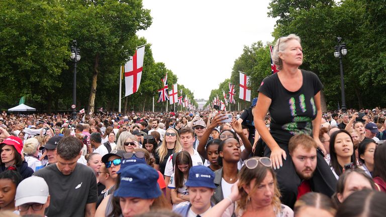 England fans celebrate during an open-top bus procession and ceremony in central London, Tuesday, July 29, 2025 after England's victory in the Women's EURO 2025 final.(AP Photo/Joanna Chan)