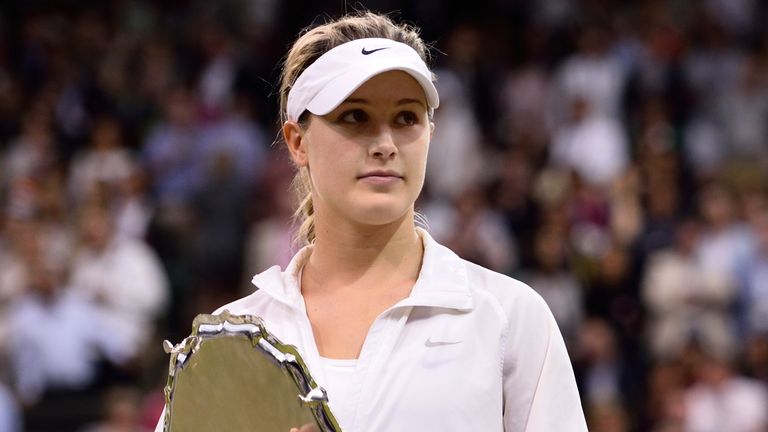 Eugenie Bouchard poses the runners-up trophy after losing to Petra Kvitova in the ladies singles final on centre court during day twelve of 