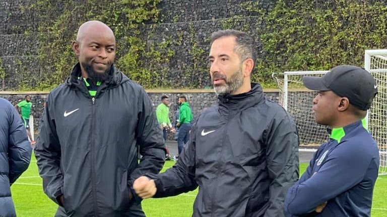 Finidi George and Acacio Santos in discussion at a Nigeria camp in Portugal