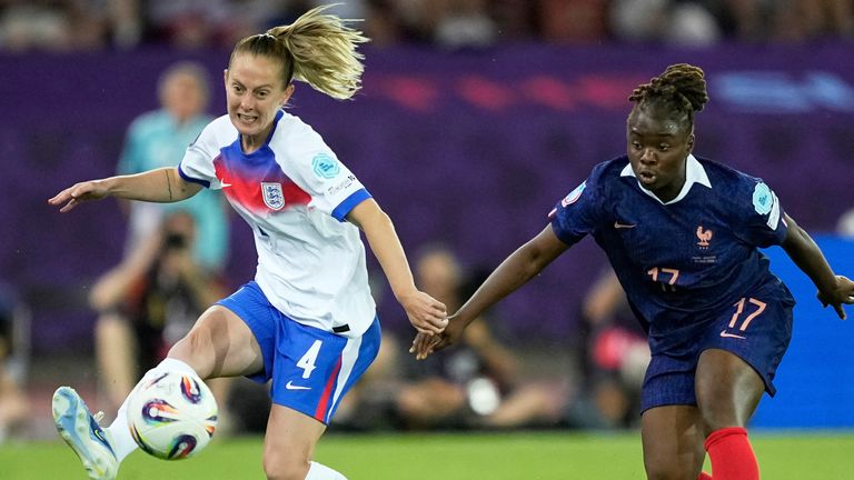 England's Keira Walsh reaches for the ball next to France's Sandy Baltimore