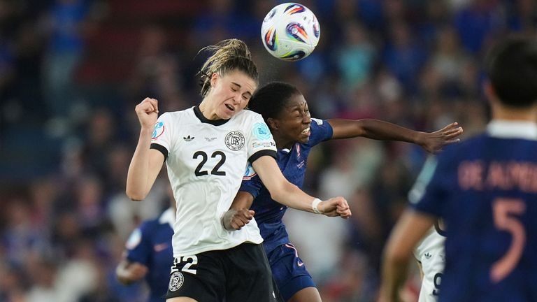 Germany's Jule Brand, left, jumps for the ball with France's Oriane Jean-Francois during the Women's Euro 2025 quarterfinals soccer match between France and Germany at St. Jakob-Park in Basel, Switzerland, Saturday, July 19, 2025. (AP Photo/Alessandra Tarantino)