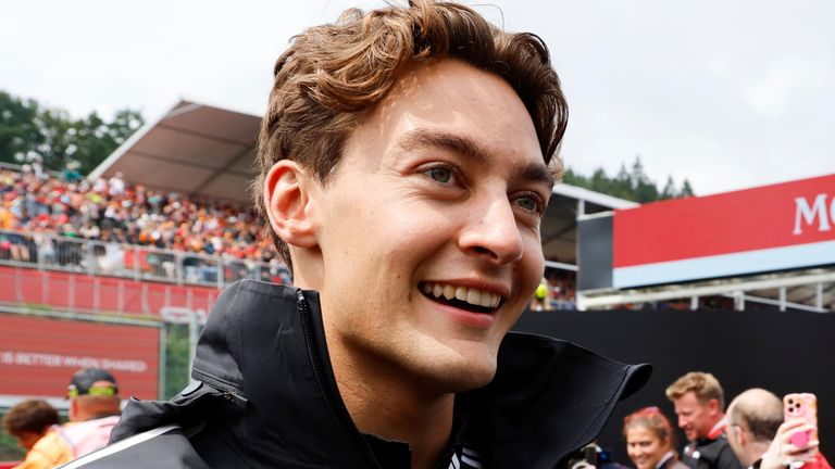 Mercedes driver George Russell of Britain, left, walks with Williams driver Alexander Albon of Thailand during the drivers parade prior to the Formula One Grand Prix at the Spa-Francorchamps racetrack in Spa, Belgium, Sunday, July 27, 2025. (AP Photo/Geert Vanden Wijngaert)