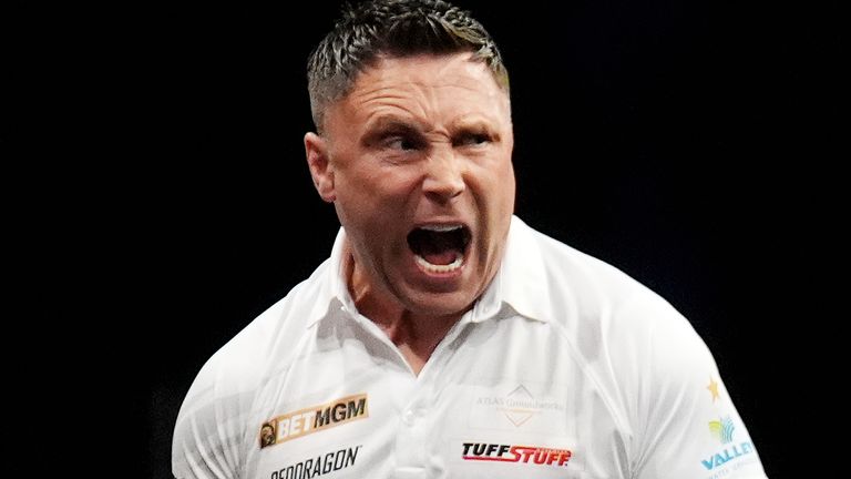Gerwyn Price celebrates in his match against Luke Littler during the BetMGM Premier League Play-Offs at The O2, London