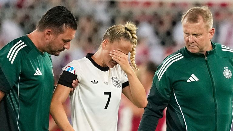Germany Giulia Gwinn leaves the field after being injured during Euro 2025, group C, football match between Germany and Poland in Arena St. Gallen in St. Galen, Switzerland, Friday July 4, 2025. (AP Photo / Martin Meissner)
