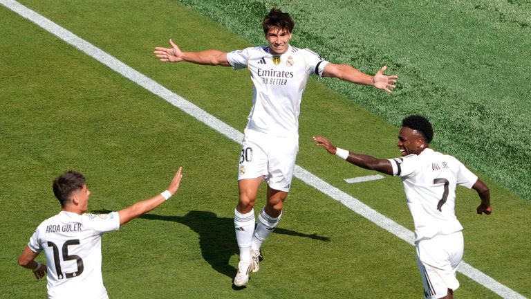 Real Madrid's Gonzalo Garcia, center, celebrates scoring his side's opening goal during the Club World Cup quarter-final vs Dortmund