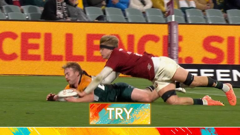 Henry Pollock gets his hand and manages to ground a loose ball as the AUNZ XV spill the ball on their own try line. 
