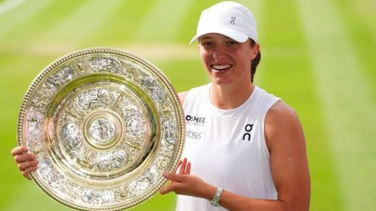 Iga Swiatek with the Venus Rosewater Dish following her Ladies' Singles Final victory over Amanda Anisimova on day thirteen of the 2025 Wimb