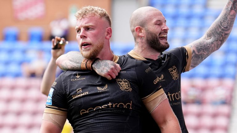 Hull FC's Jack Ashworth (left) celebrates his try against Wigan Warriors with Zak Hardake (right)