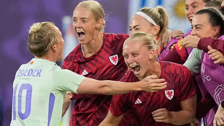 Wales' Jess Fishlock celebrates with teammates after scoring their equlaiser against France (AP Photo/Martin Meissner)