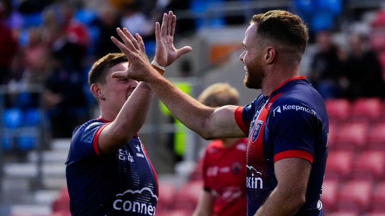 Hull KR's Joe Burgess celebrates a try with team-mate Jack Broadbent