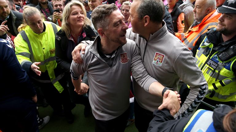 Jon Brady celebrates winning promotion with Northampton Town